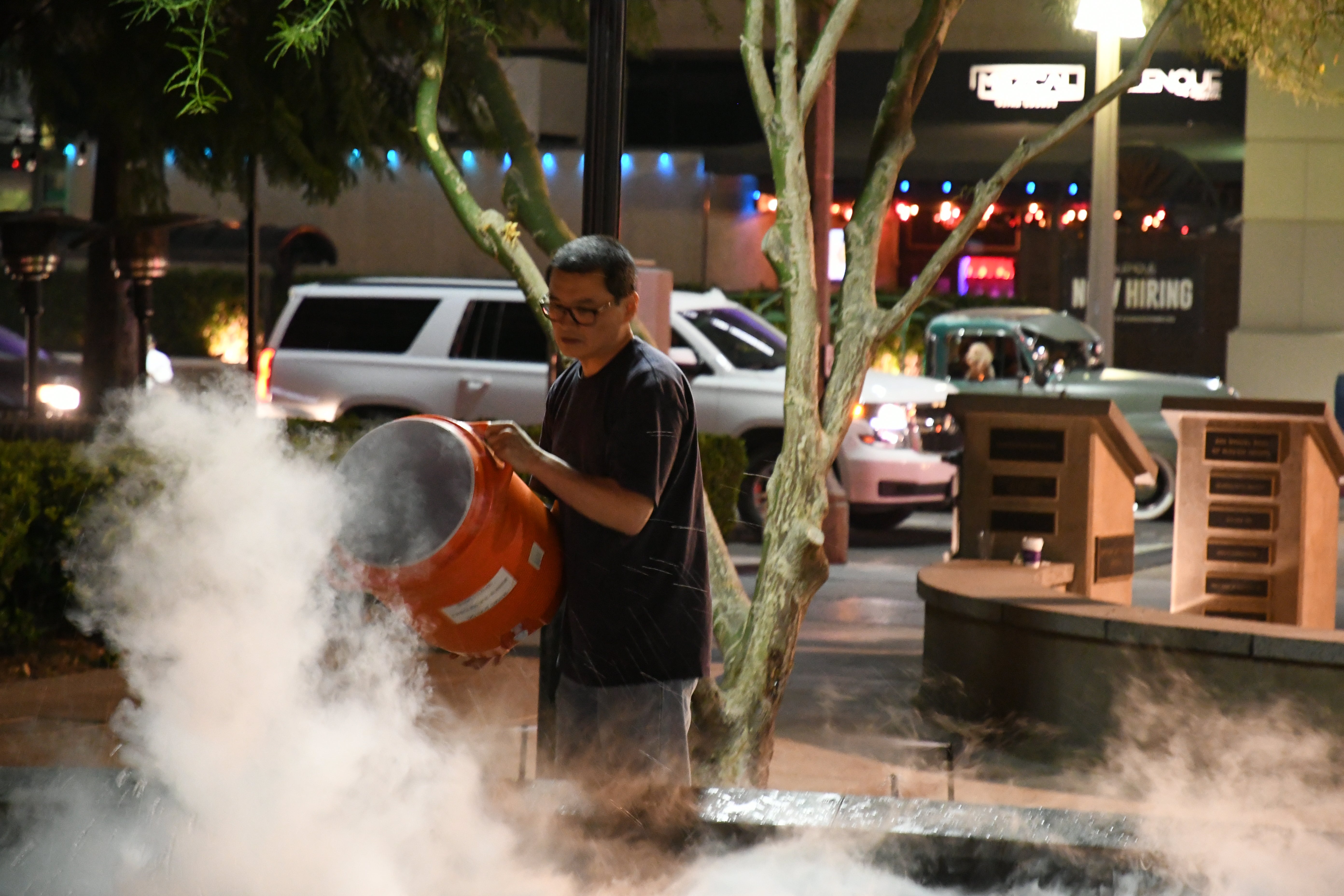 Jae Eu pouring dry ice during a demonstration